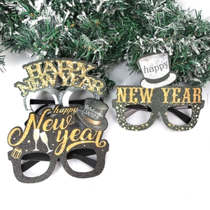 2025 Happy New Year party glasses props in black and gold glitters on white background