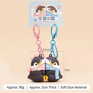 Cute magnetic hugging penguin keychain pair in pink and blue soft PVC material