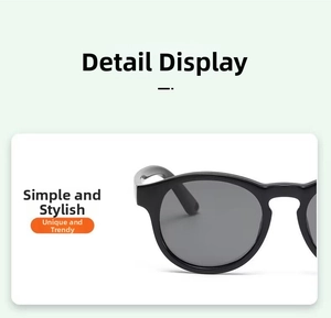Close-up of black round silicone baby sunglasses with dark polarized lenses
