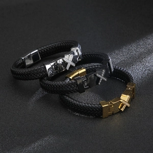 Braided leather bracelets for men with diamond-set cross buckles in gold, silver, and black