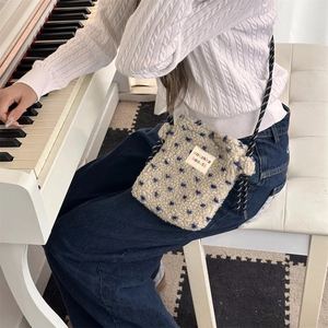 Plush crossbody bag with star pattern shown in a cozy lifestyle scene by a piano