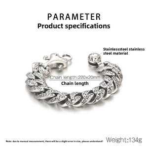 Detail view of punk style silver stainless steel bracelet with engraved Egyptian patterns