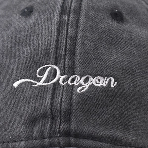 Washed cotton baseball cap with white Dragon embroidery and vintage distressed texture