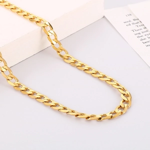 Close-up of 7mm golden NK Cuban chain necklace with minimalist square pendant on display