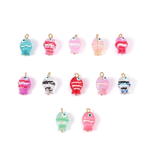 Detailed view of twelve colorful hand-painted glass fish pendants with gold loops