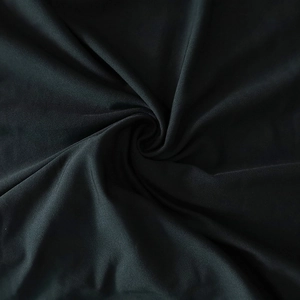 Close-up of the soft black knitted fabric texture with a smooth finish and slight sheen