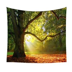 Detail of forest tapestry showing sunlight through trees and autumn leaves on white wall