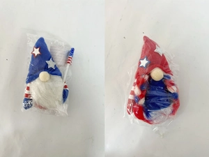 Detail view of Independence Day plush gnomes with American flag patterns in polybag