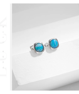 Detailed close-up of square S925 silver stud earrings with blue opal stones