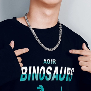 Detailed view of silver Byzantine steel necklace worn by a male model on a black tee