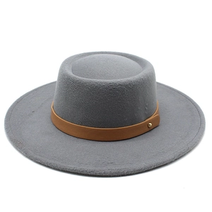 Detailed close-up of the grey wool felt flat top hat with brown leather band and gold stud