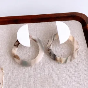 Minimalist geometric resin earrings with marble pattern and white semicircular detail