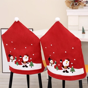 Christmas non-woven chair covers with Santa Claus and snowman motifs in home setting