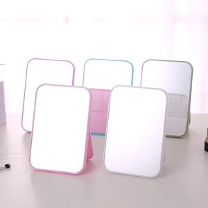 Minimalist square desktop vanity mirrors with foldable stands in multiple pastel colors