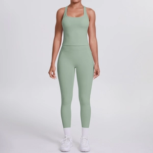 Front view of mint green high-waist yoga leggings and racerback sports bra set