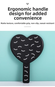 Detail of heart-shaped handheld mirror featuring a matte finish and eyelash pattern print