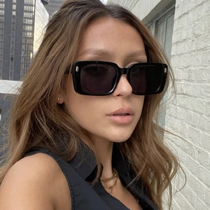 Classic oversized square black sunglasses with silver rivet accents and dark lenses