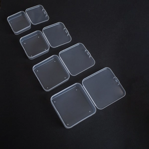 Detailed view of four sizes of clear PP square storage boxes with flip lids and latches