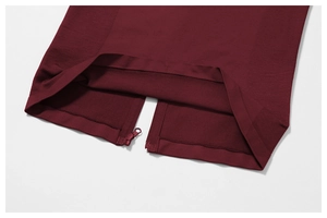 Macro detail of high-quality seamless zipper and knit texture on burgundy sports jacket