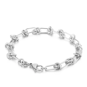 Polished silver knot chain bracelet with oval links and lobster clasp on white background