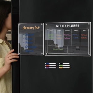Clear acrylic magnetic weekly planner and grocery list boards on black fridge with 6 markers