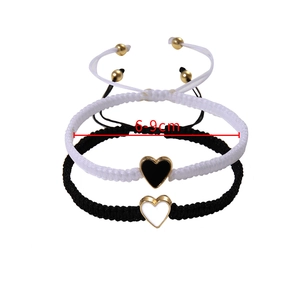 Adjustable 6-9cm diameter detail of handmade braided heart bracelets with gold accents