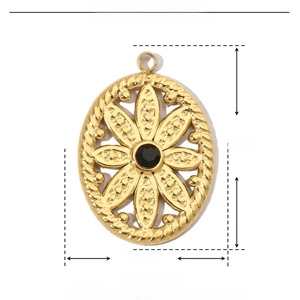 Detail view of a 22mm gold stainless steel floral pendant with black rhinestone
