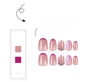 Detail of short oval press-on nails with pink marble texture and rhinestone accents