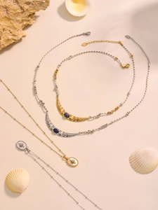 Detail of bohemian ocean necklaces with moon crescent pendants and starfish shells
