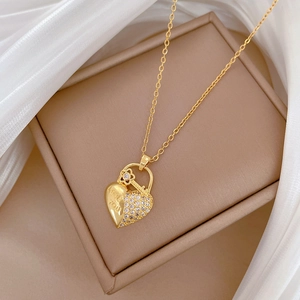 Elegant gold titanium necklace with heart lock and key pendant engraved with LOVE YOU