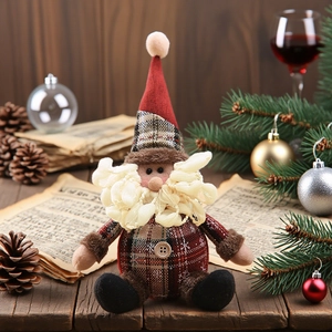 Rustic Santa Claus plush ornament with red plaid fabric and wooden button on a festive table