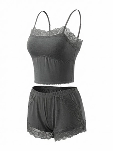 Detail of dark grey sleepwear set featuring intricate floral lace trim and soft fabric