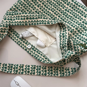 Top view of floral canvas tote bag interior with magnetic clasp and zipper pocket