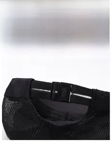 Detail of adjustable elastic strap and plastic buckle on breathable mesh cadet hat