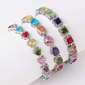 Detailed shot of rainbow zircon bracelets featuring heart, oval, and square cut stones