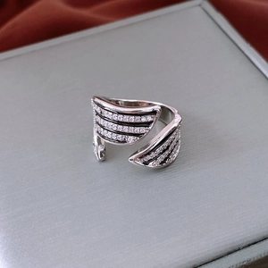 Close-up of vintage wide striped open ring with black enamel and white zircon inlay
