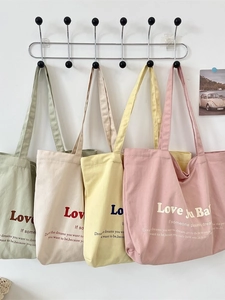 Minimalist canvas tote bags in four pastel colors with chic letter printing