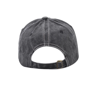 Close-up of washed cotton baseball cap back with adjustable bronze buckle and contrast stitching