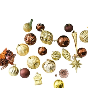 Luxury Christmas tree ornament set featuring gold pinecones and Joy to the World tags