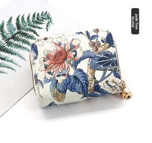 Detail of floral zipper card holder with vintage peony pattern and gold metal hardware