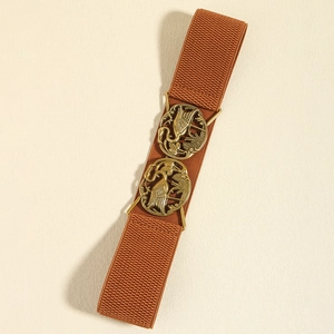Detail of elastic waist belt with antique bronze buckles featuring crane engraving