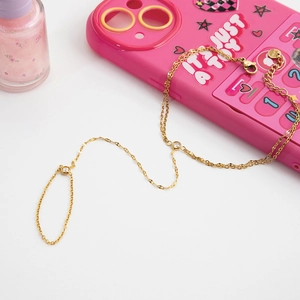 Macro detail of adjustable gold link hand chain with sparkling round cubic zirconia stones