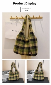 Detailed view of green plaid plush tote bag featuring 79 FASHION leather brand label