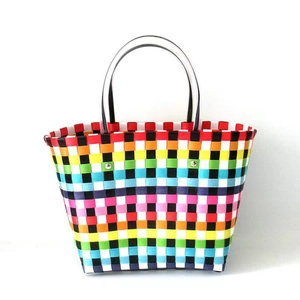 Detailed macro view of colorful rainbow woven texture and transparent tube handles