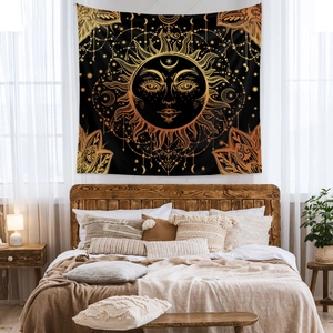 Detail of bohemian sun tapestry hanging above a wooden bed in a cozy bedroom