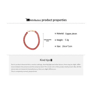 Detailed view of 18k gold plated bracelet with red zircon gemstones and lobster clasp