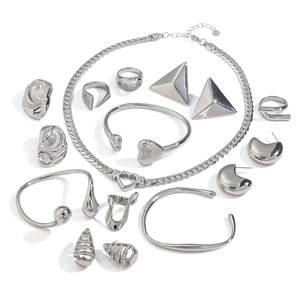 Modern silver stainless steel jewelry set including heart necklace, bangles, rings and earrings
