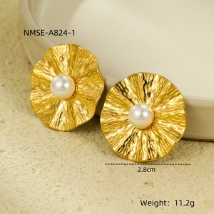 Macro detail of textured gold round stud earrings with pearl center and 2.8cm diameter