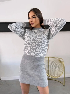 Women's grey Fair Isle knit set featuring crewneck sweater and matching mini skirt