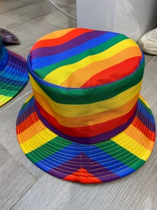 Top view of reversible rainbow striped bucket hat showing vibrant fabric texture and shape